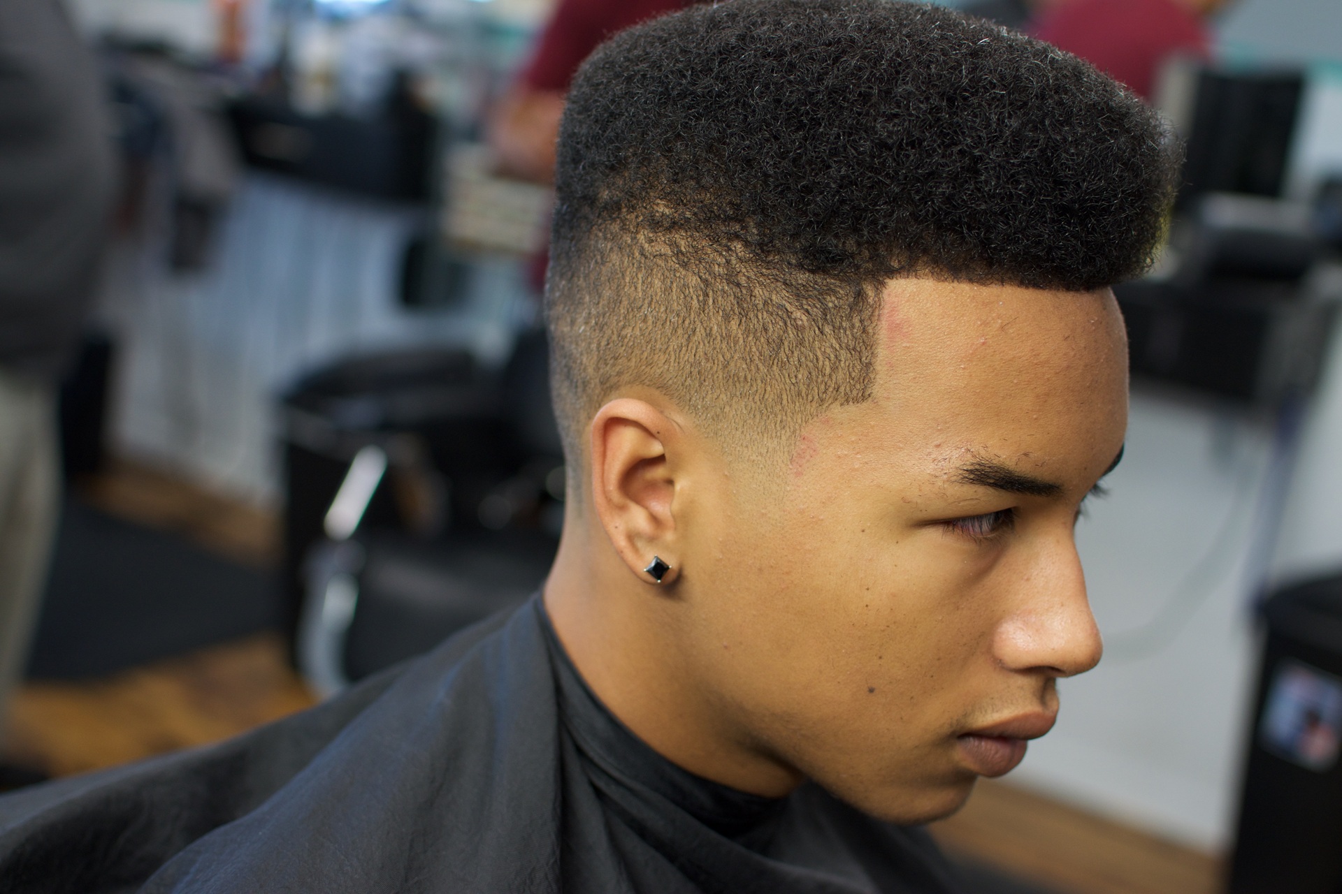 Barber performing a precision haircut
